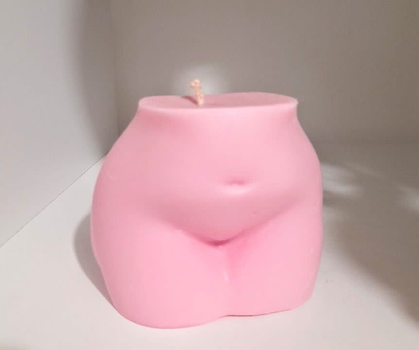 Pink female form shaped candle
