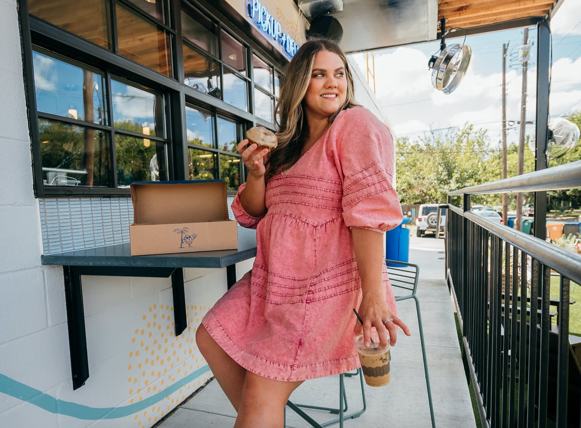 Woman wearing a second hand blush pink dress