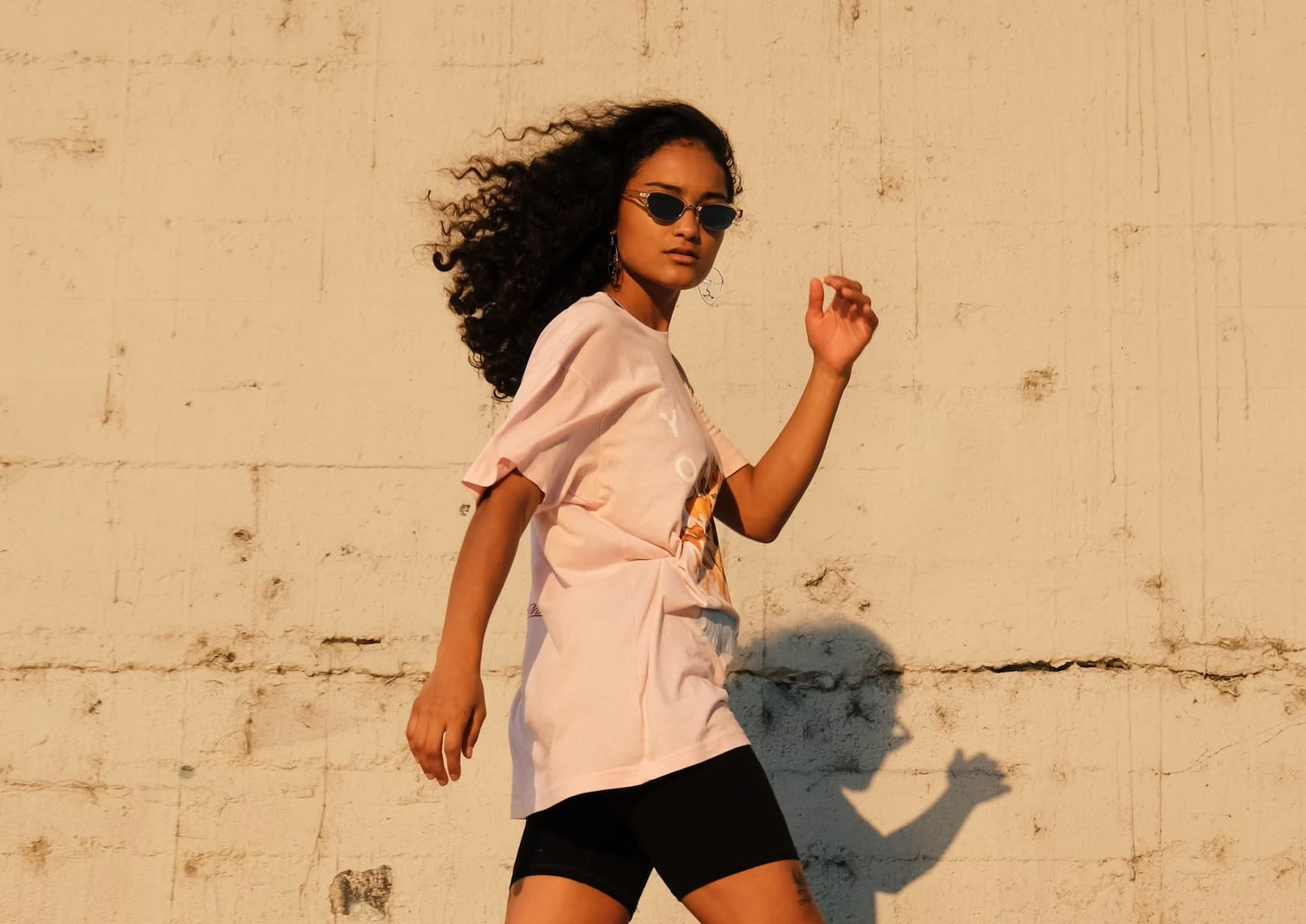 Woman wearing a second-hand casual streetwear outfit during summer