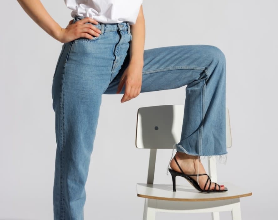 Woman wearing second-hand straight leg jeans