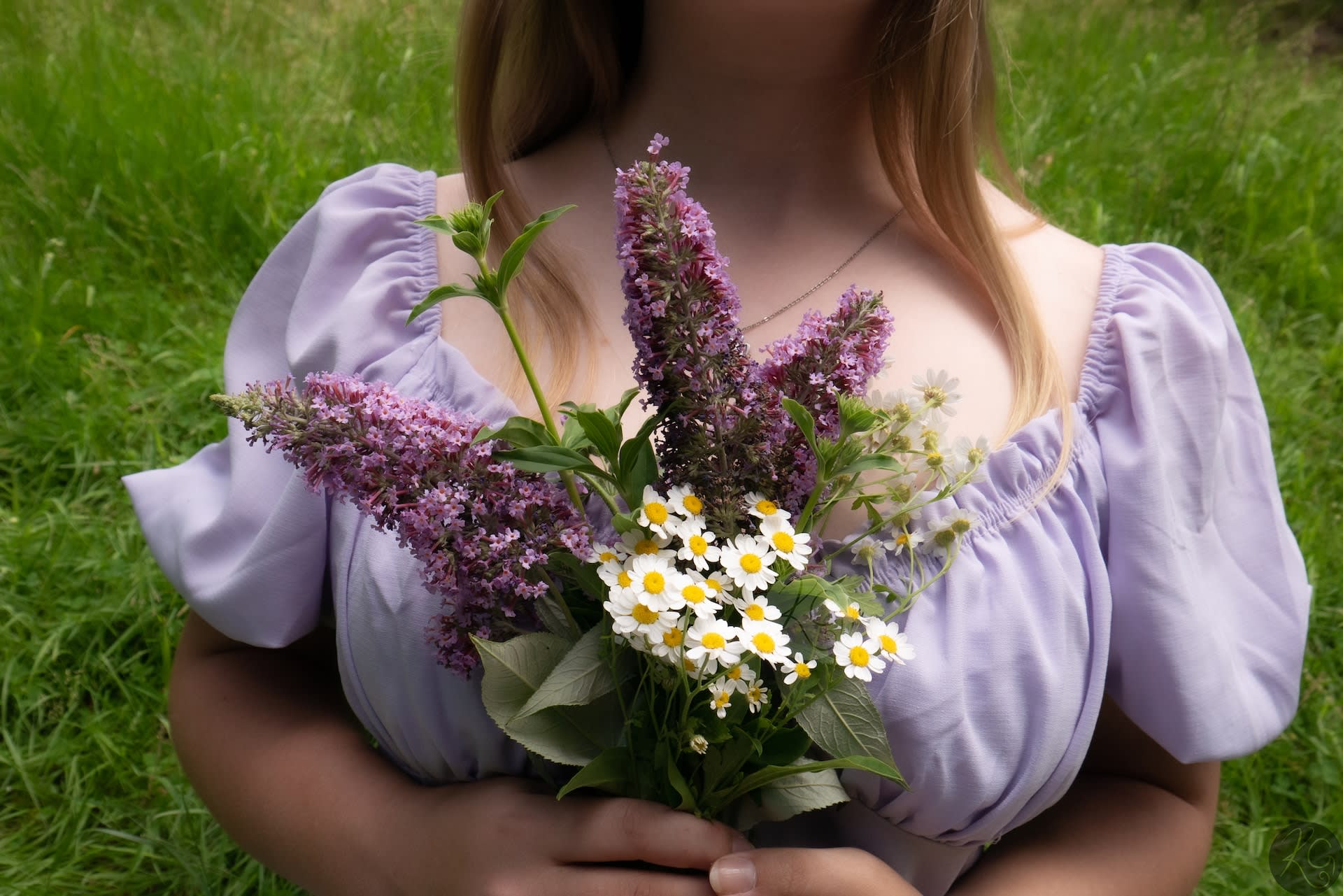 Woman wearing a lilac pre-loved milkmaid top