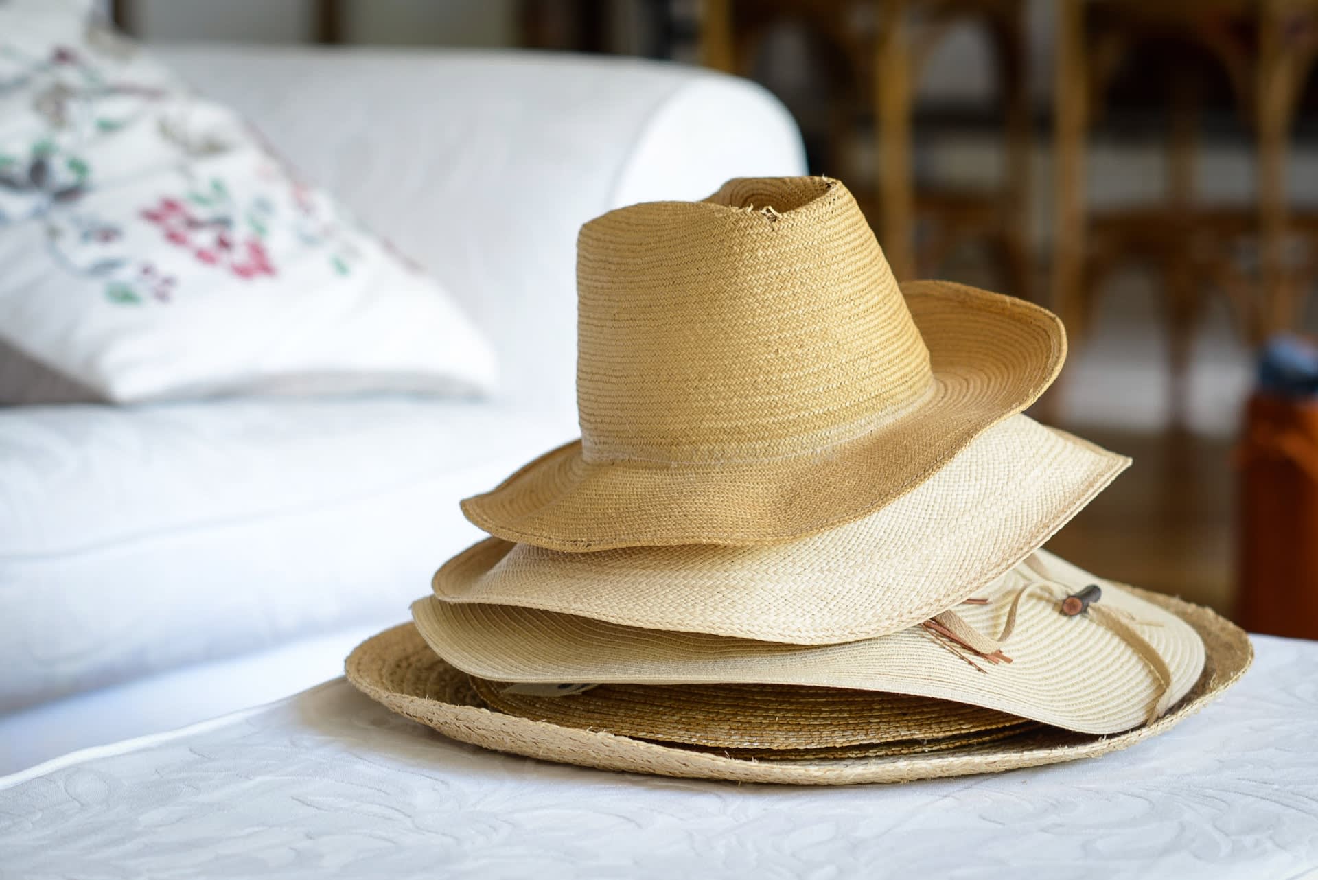 Pile of vintage straw hats