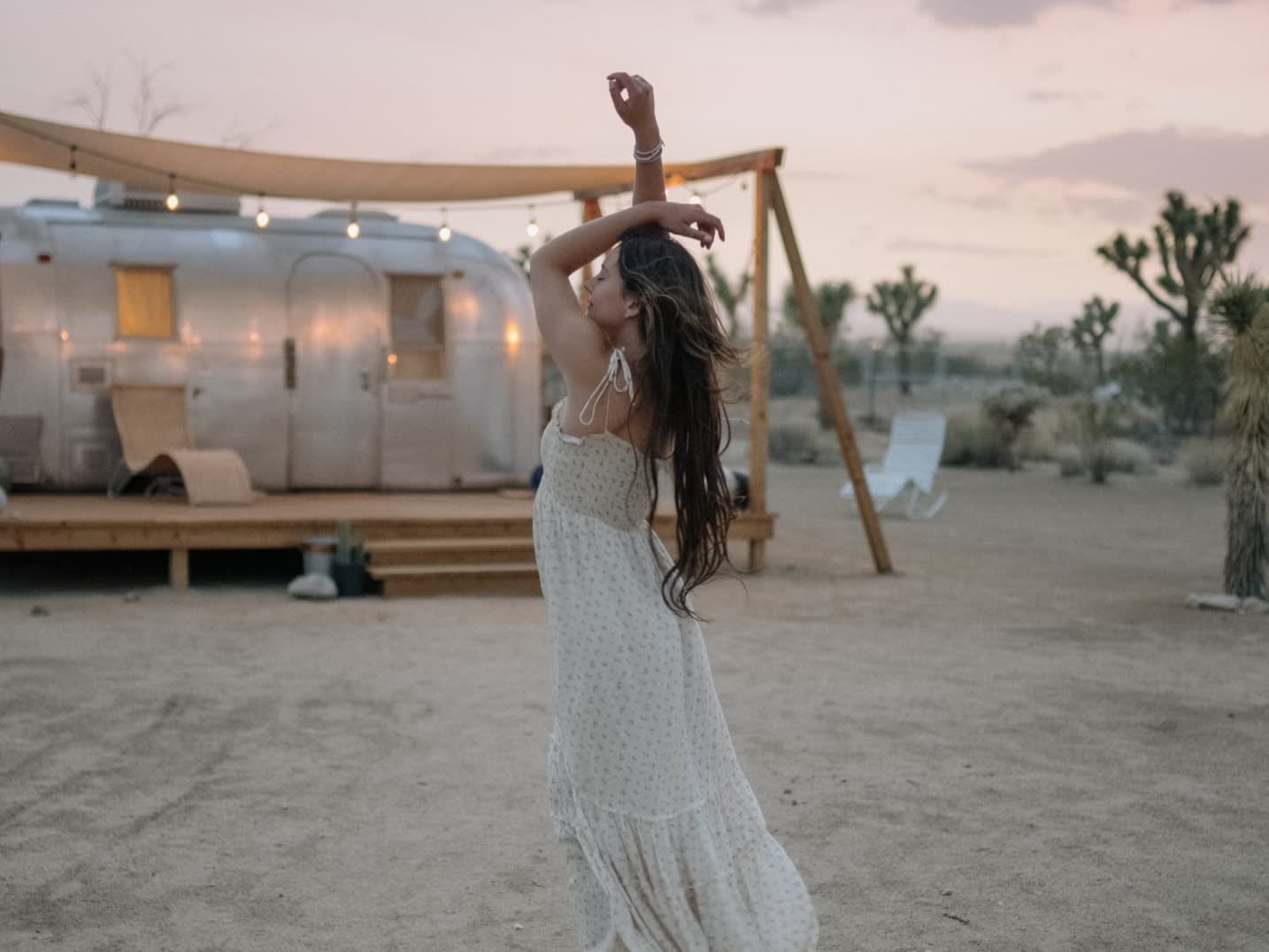 Woman wearing a pre-loved white sundress