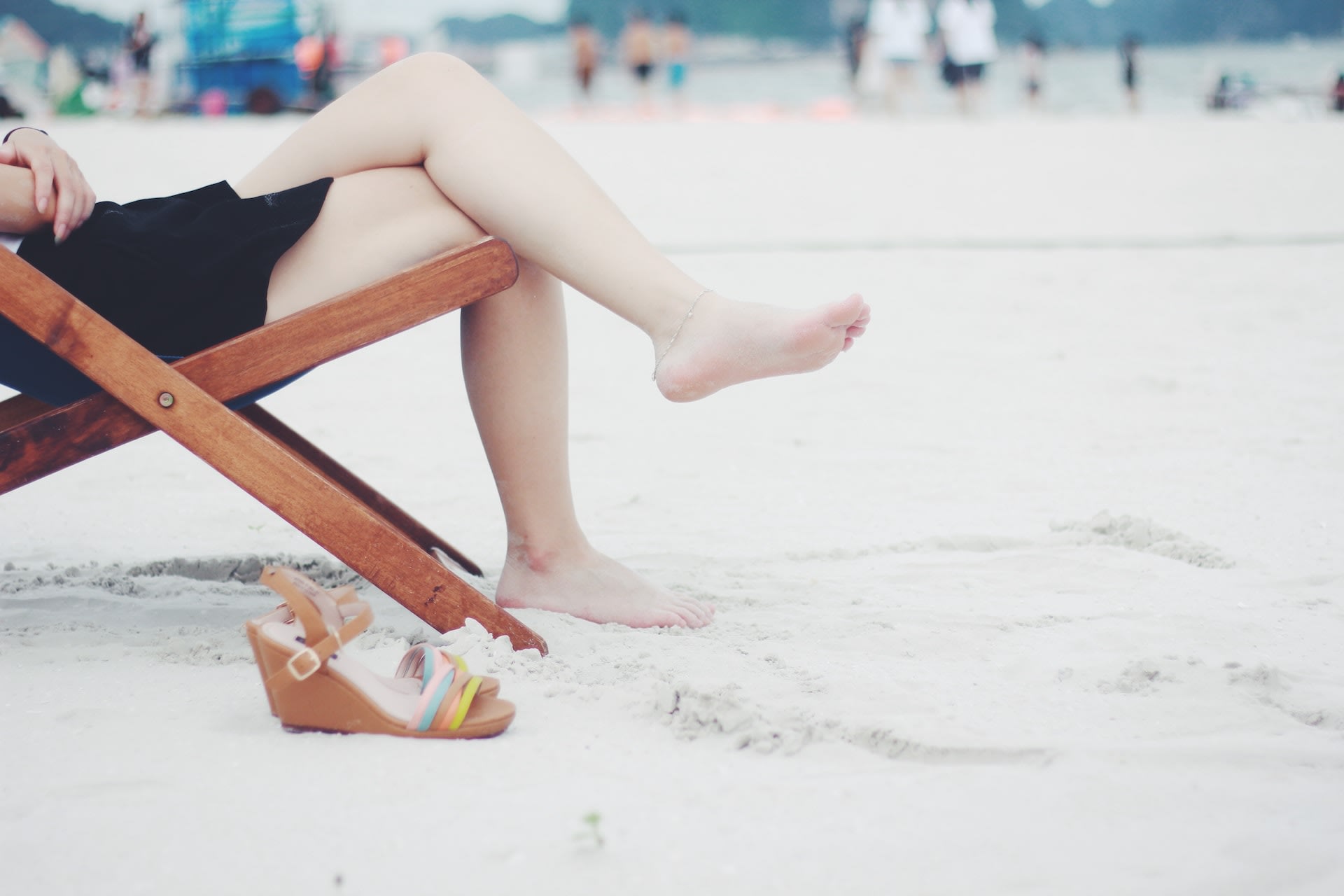 Second-hand striped wedge sandals on the beach