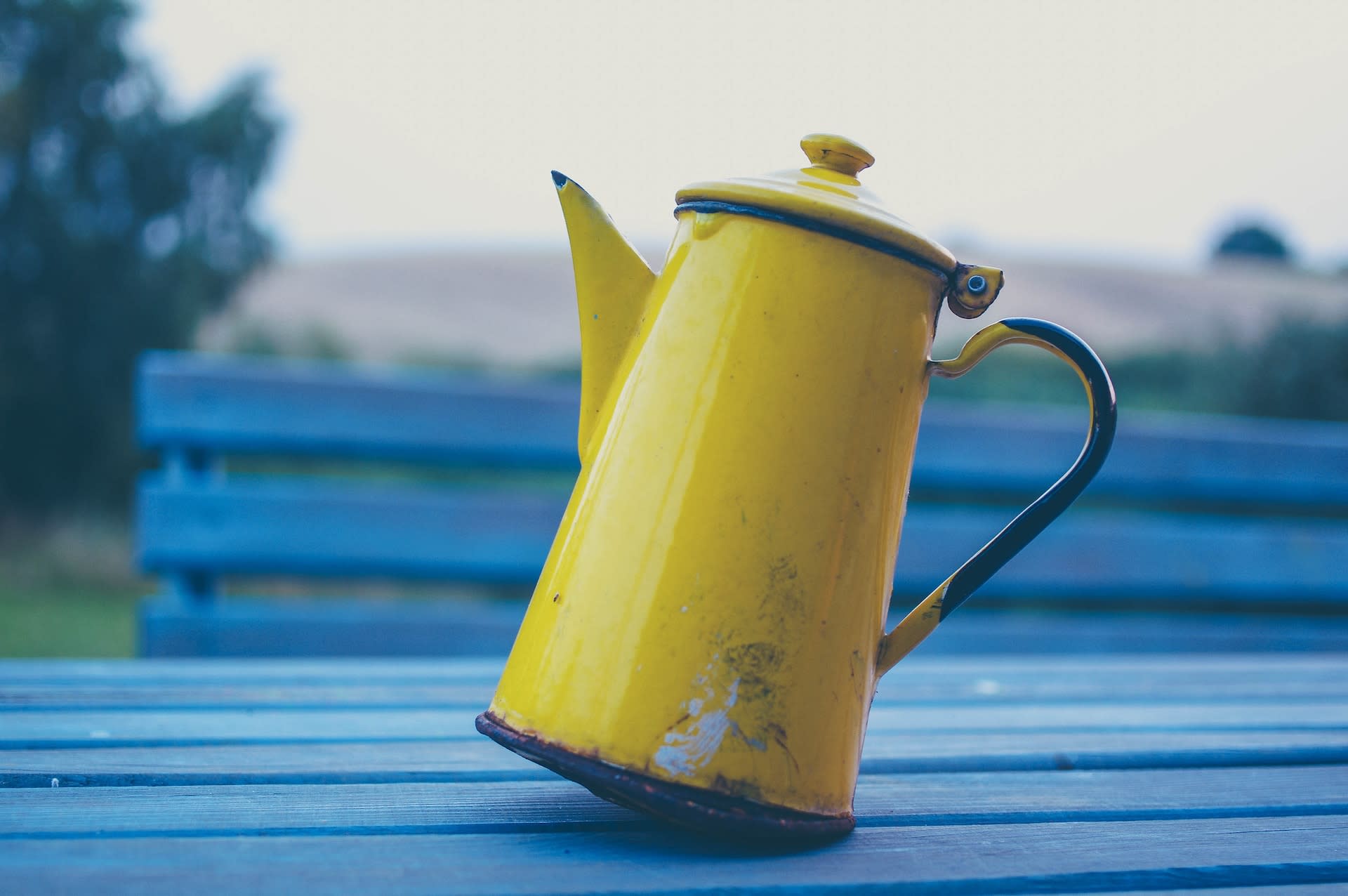 a yellow jug on a blue table