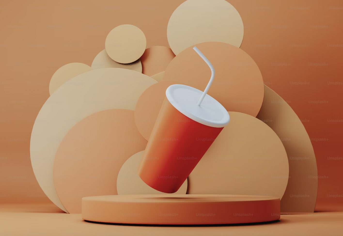 an orange plastic cup infront of an orange background