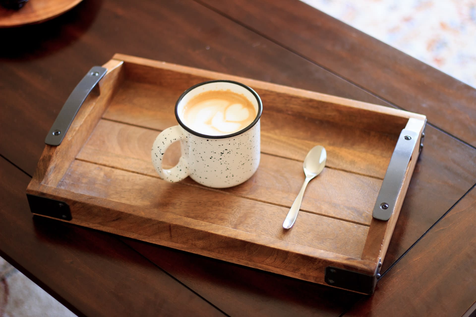 wooden tray with a mug on it