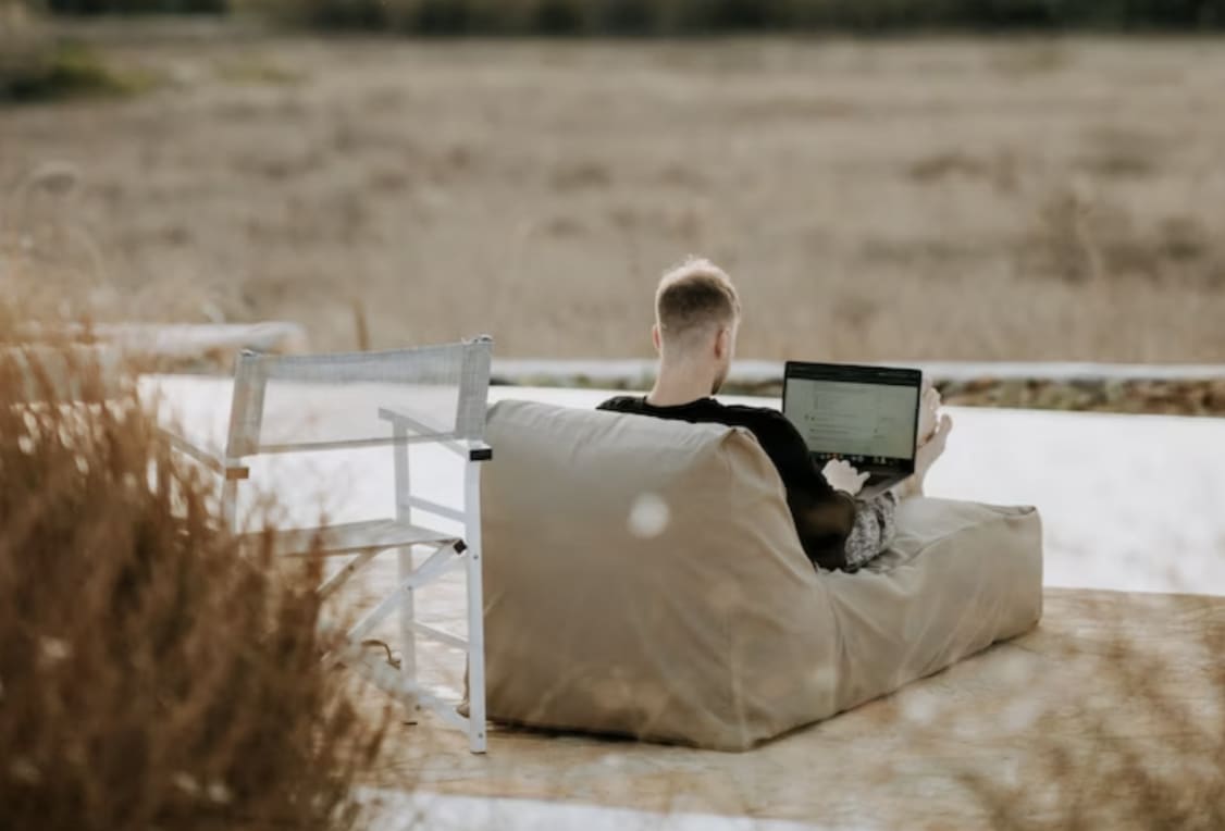 a man working on an outdoor beanbag