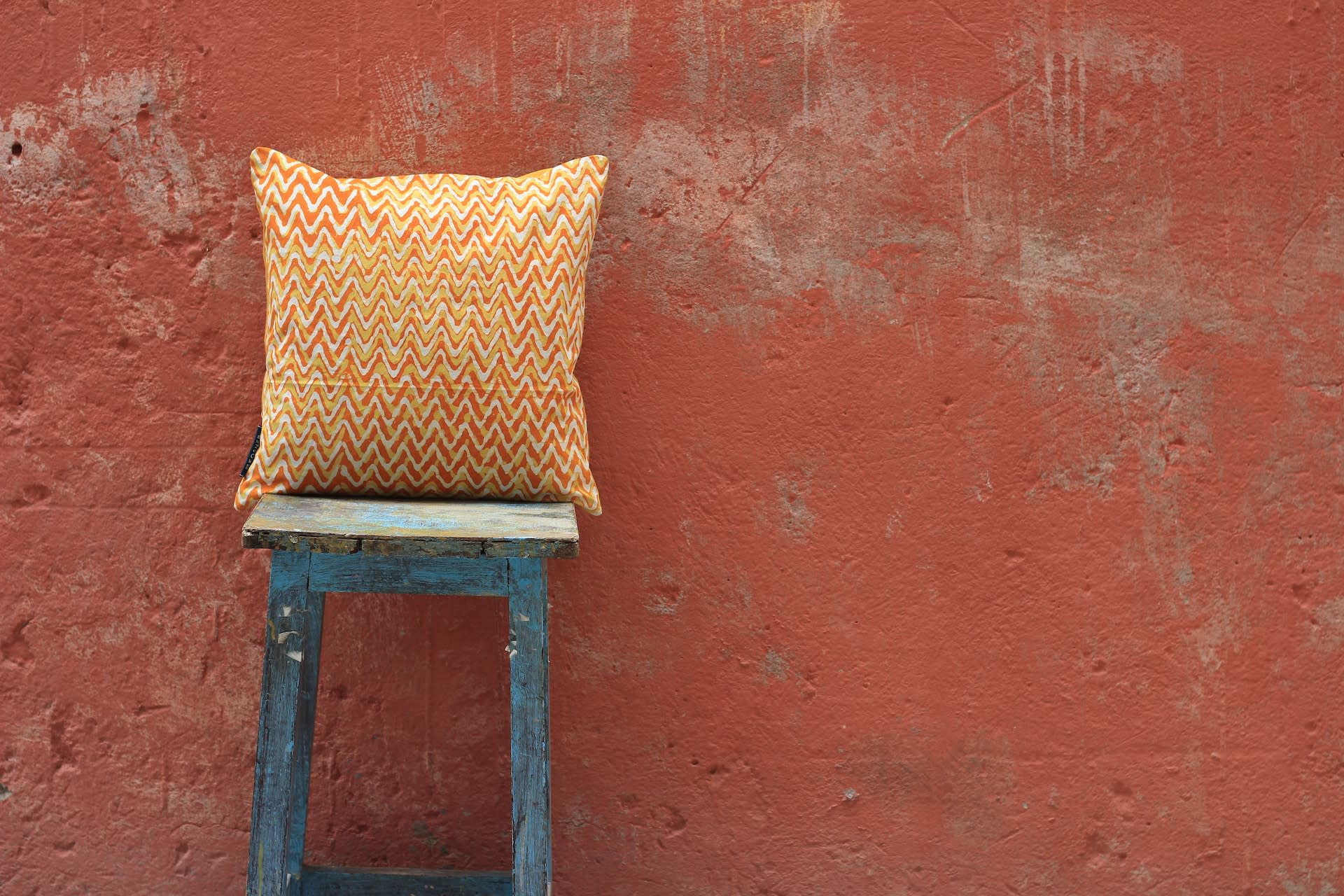 a cushion on an outdoor stool