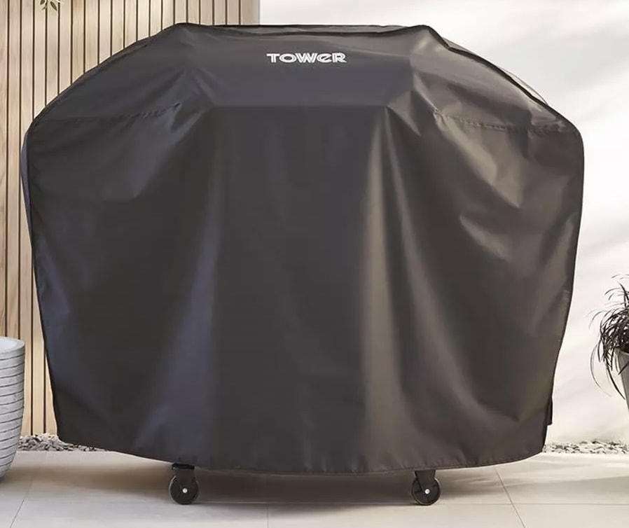 a bbq with a cover on