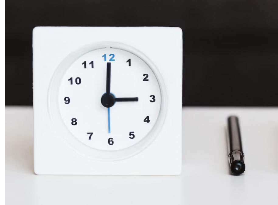 White second hand alarm clock