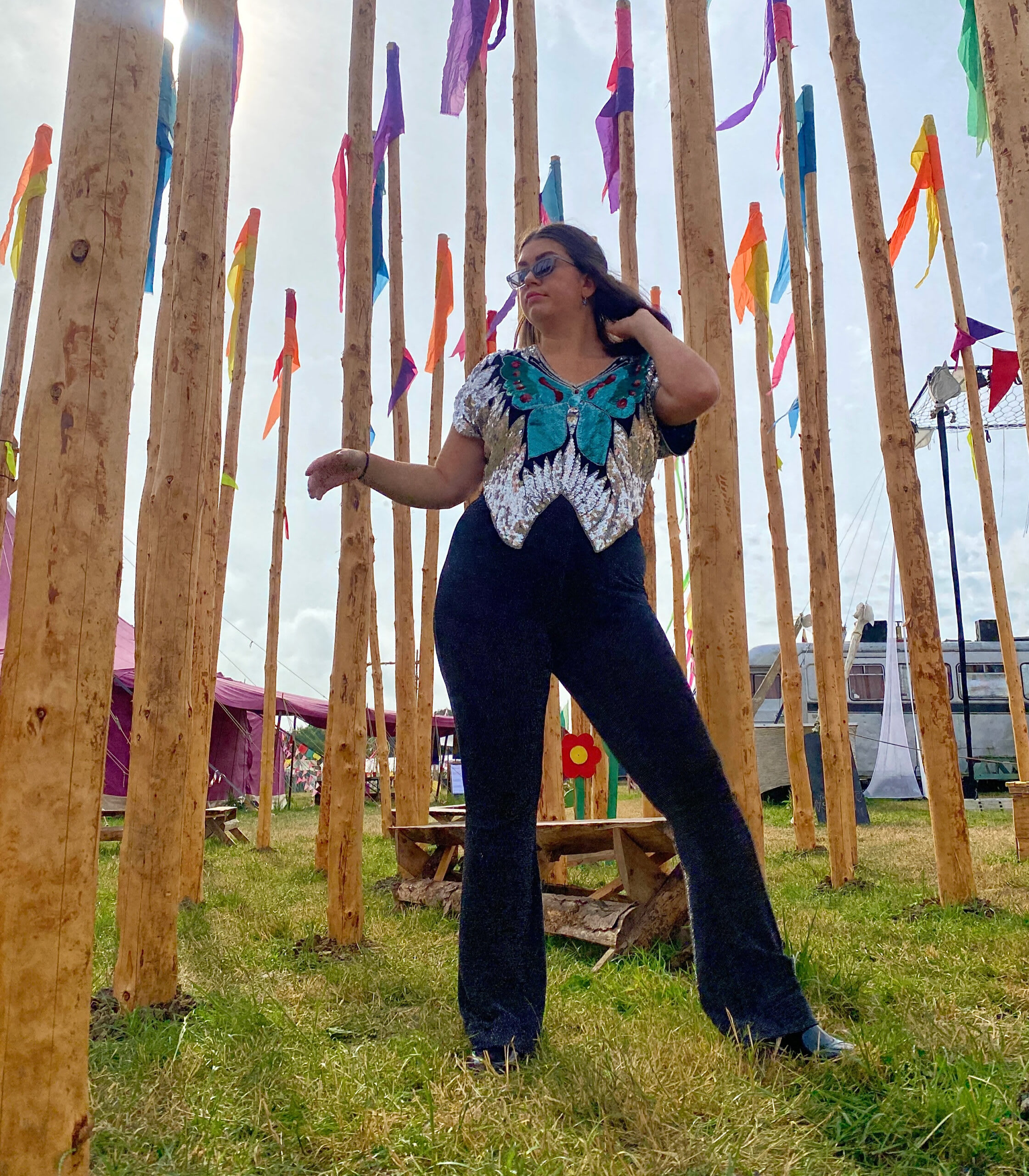 Amy styling a vintage sequin butterfly top with black flares for a festival.