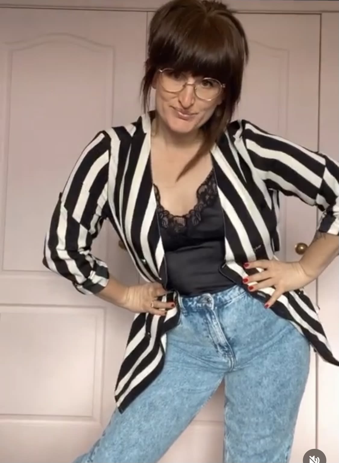 Little Splash styling a black and white striped jacket with jeans.