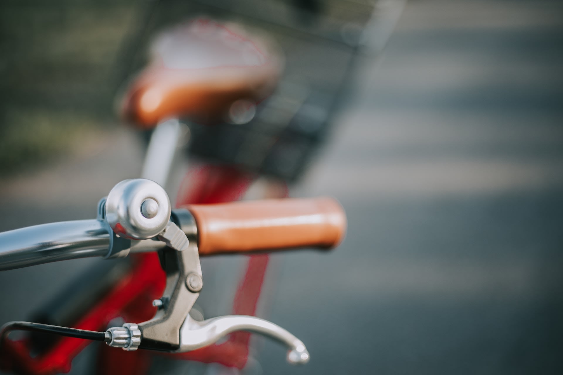 Second hand bell on the front of a bike handle.