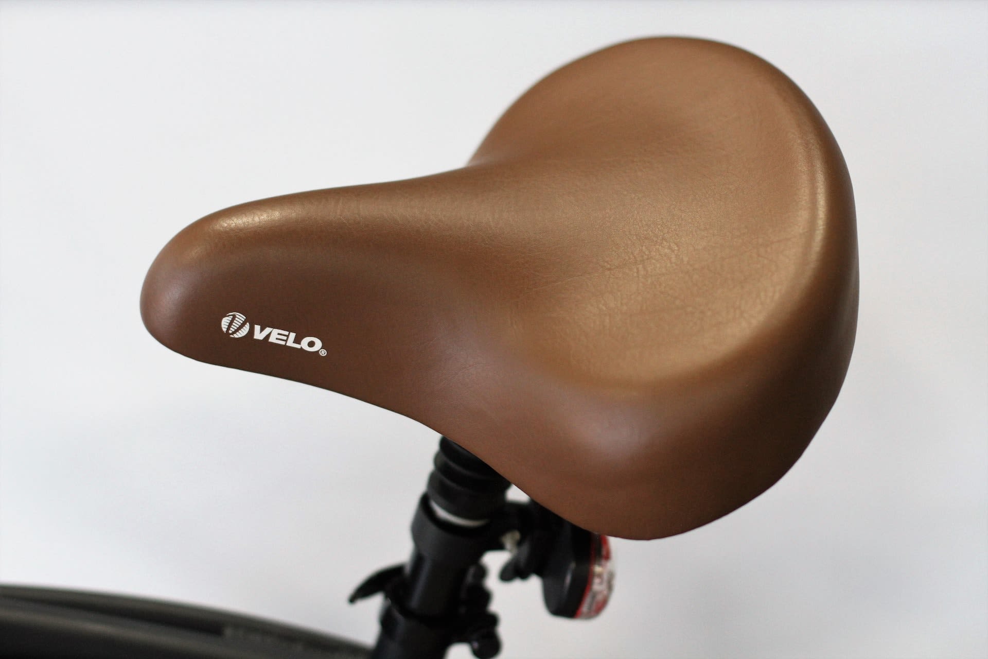 Brown leather bike seat.