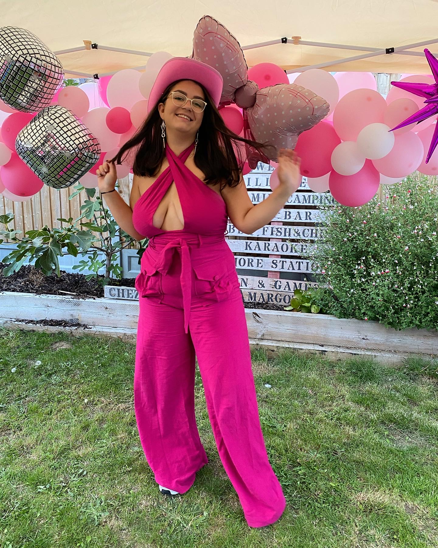 Amy wearing a stunning pink second hand jumpsuit