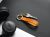 Loading placeholder for Orange key chain on desk