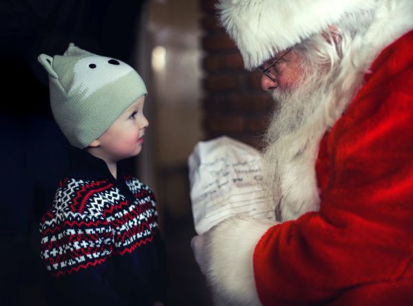 Santa with list and boy