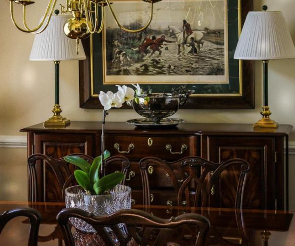 Dark wood vintage sideboard in traditionally decorated room