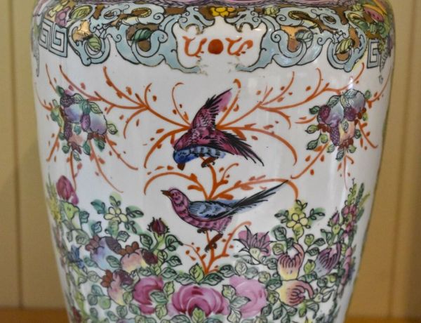 Vintage oriental vase with birds as the central scene