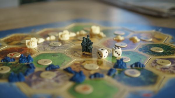 Board game with dice on top of it