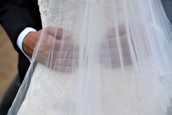 Bride wearing a long second hand veil