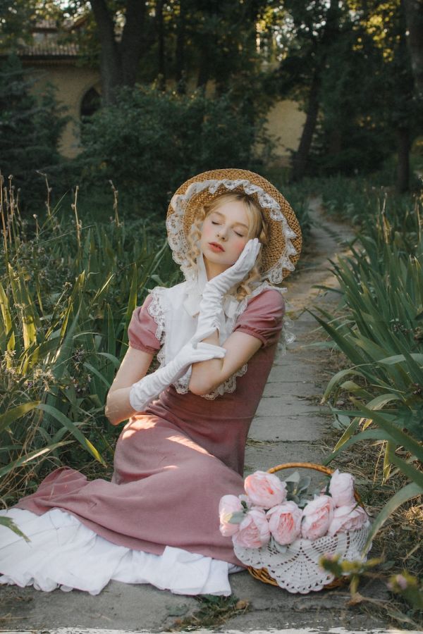 Edwardian woman wearing frills and a wide brimmed hat