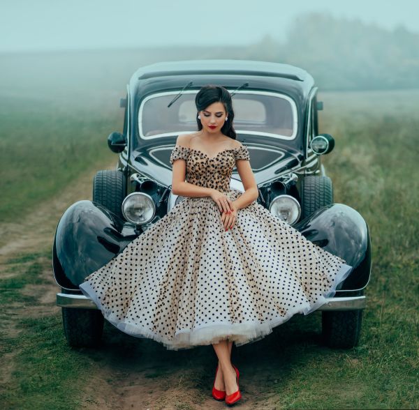 Woman wearing polka dot dress 50s or 60s style