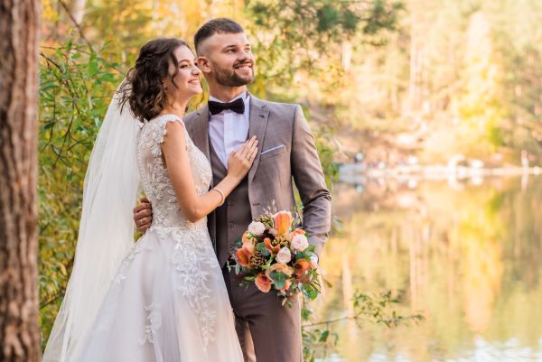 Bride and Groom dressed in pre-loved on their wedding day