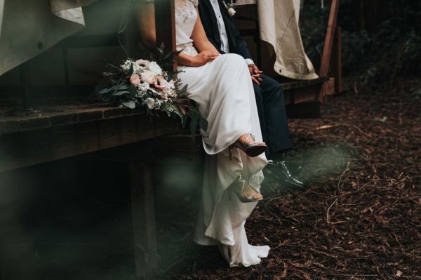 Bride wearing a second-hand satin wedding dress on the day of her wedding