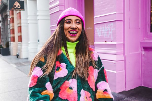 Woman wearing a quirky and colourful second-hand outfit