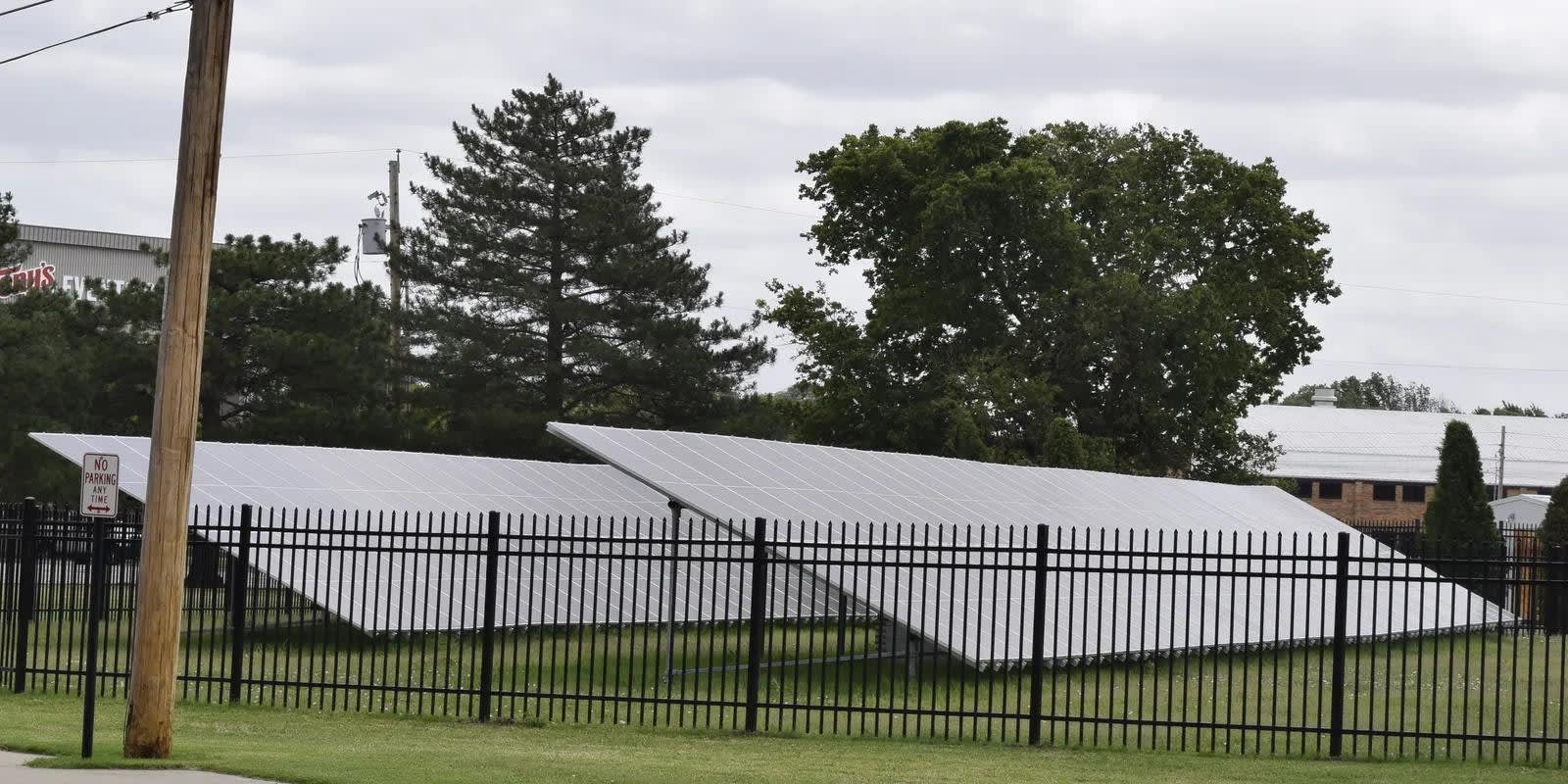 solar panels behind a fence