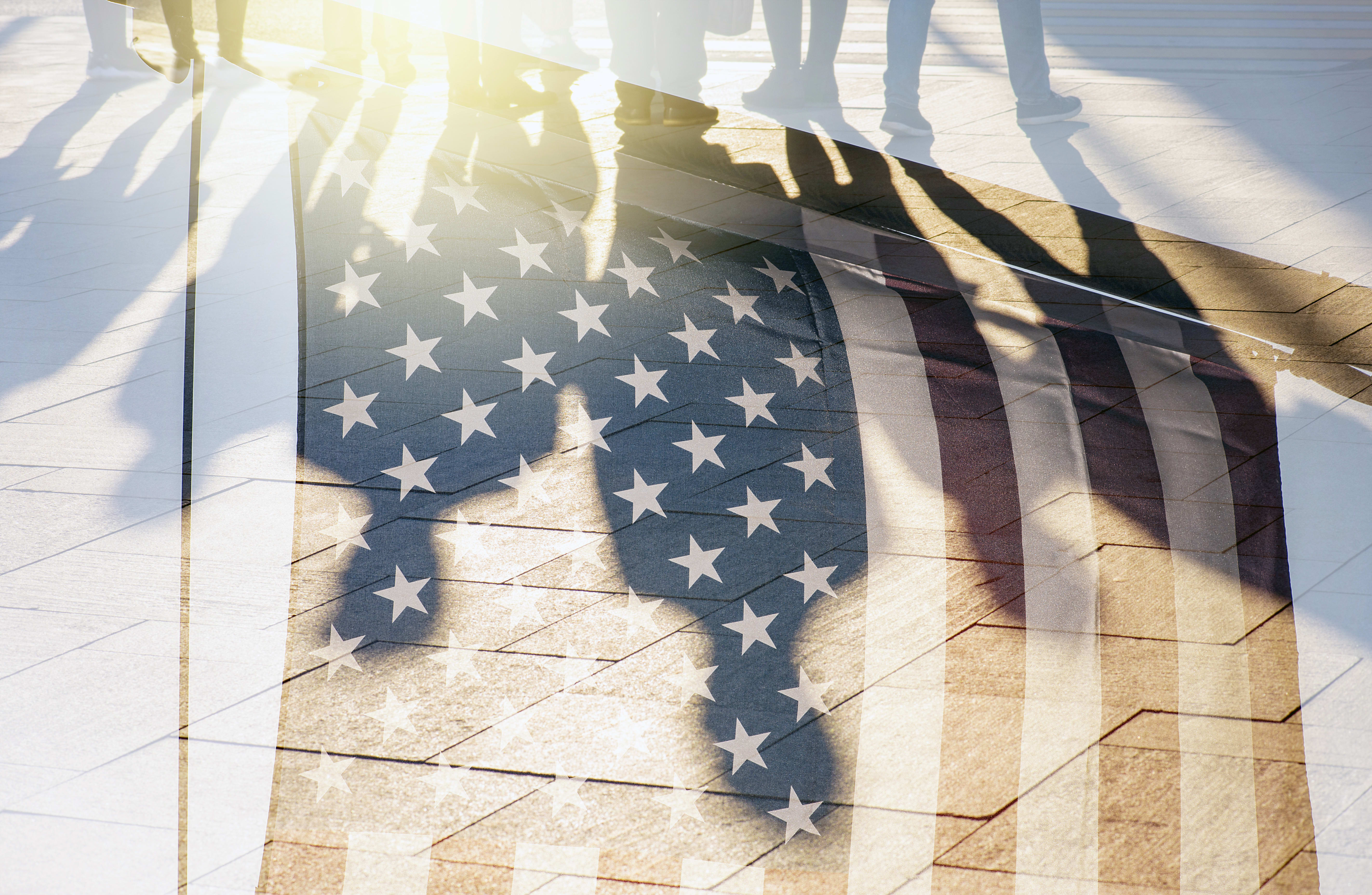 Shadow of people with the American flag