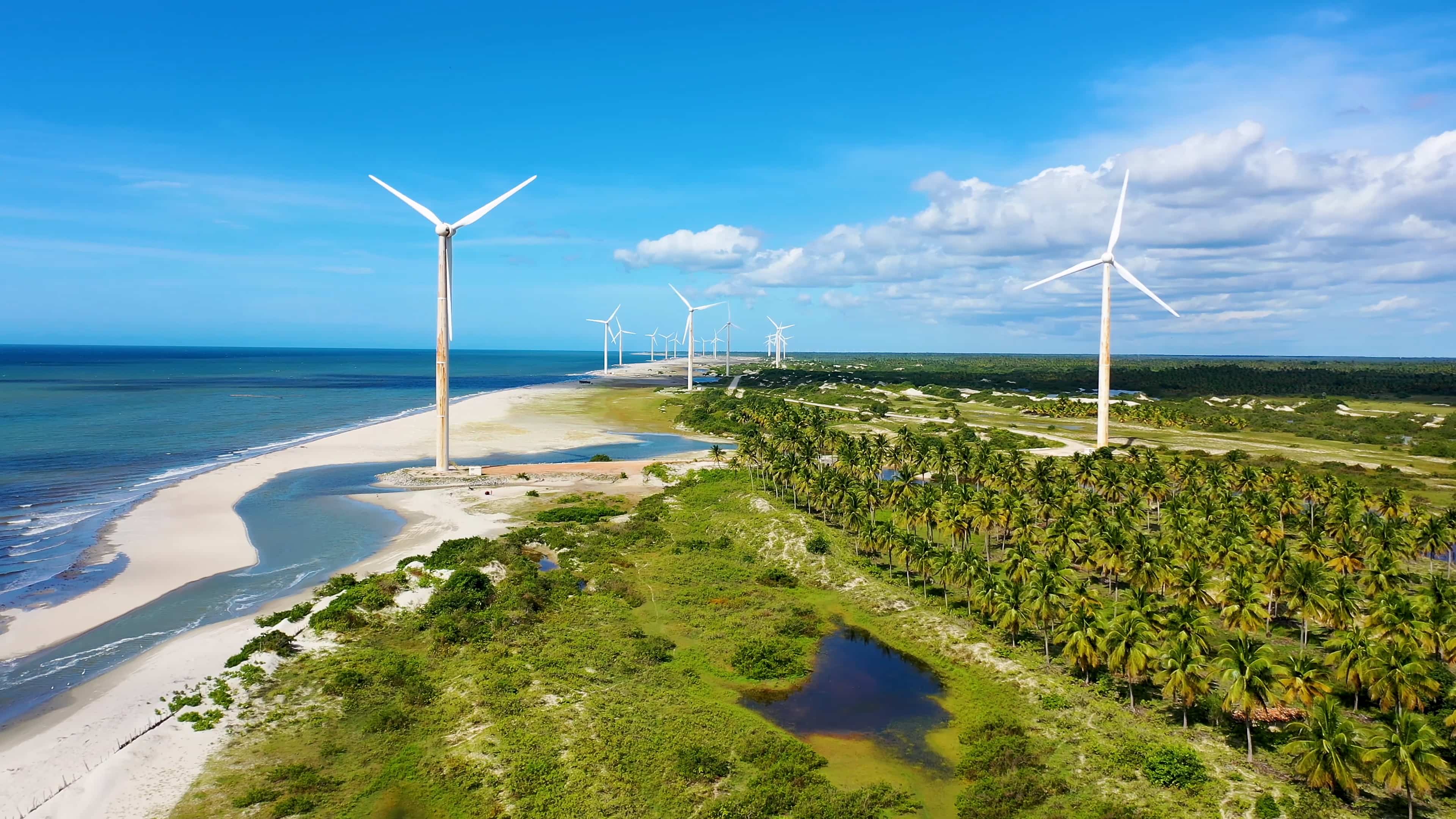 Wind turbines on the beach by the ocean