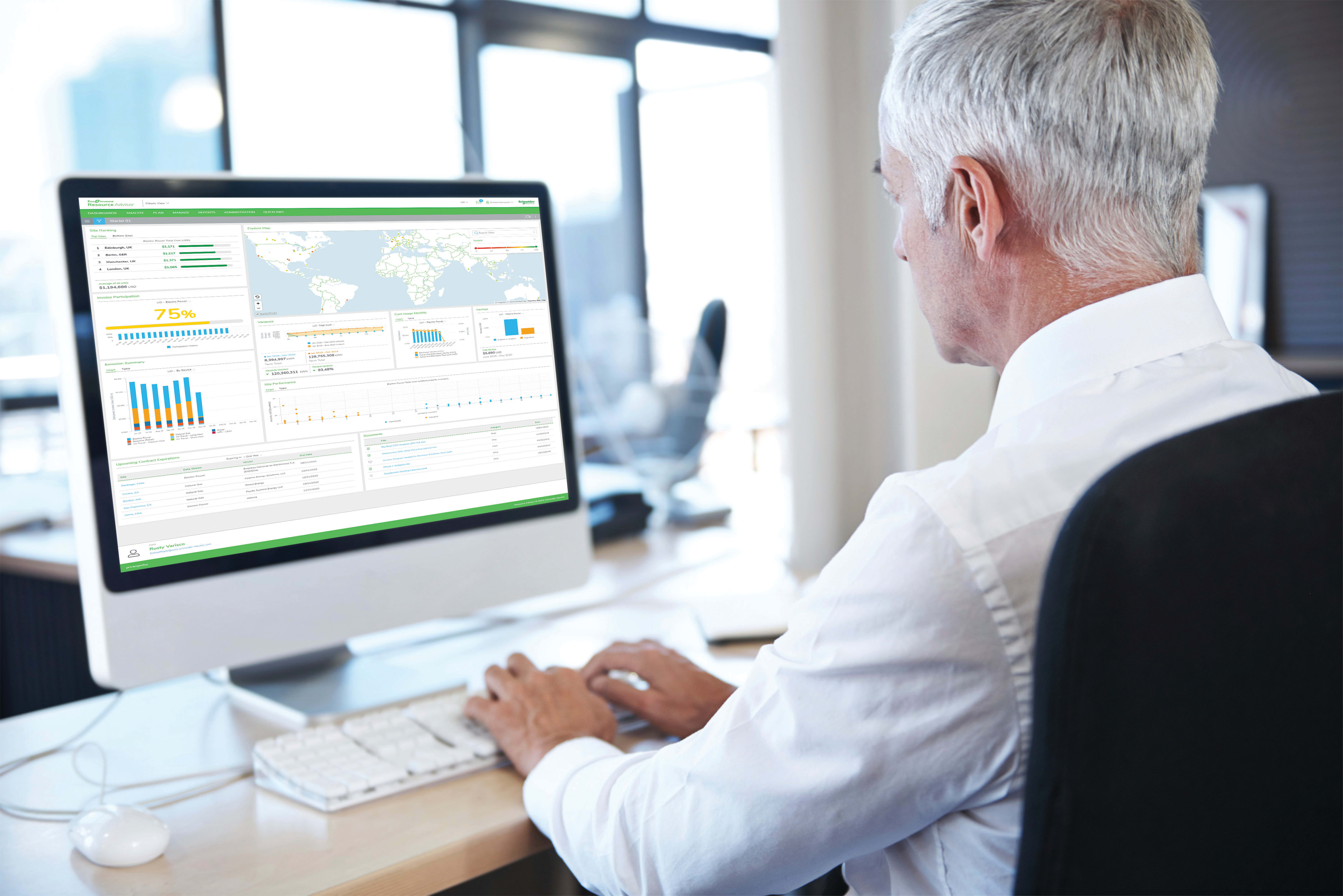 man sitting at a computer looking at data