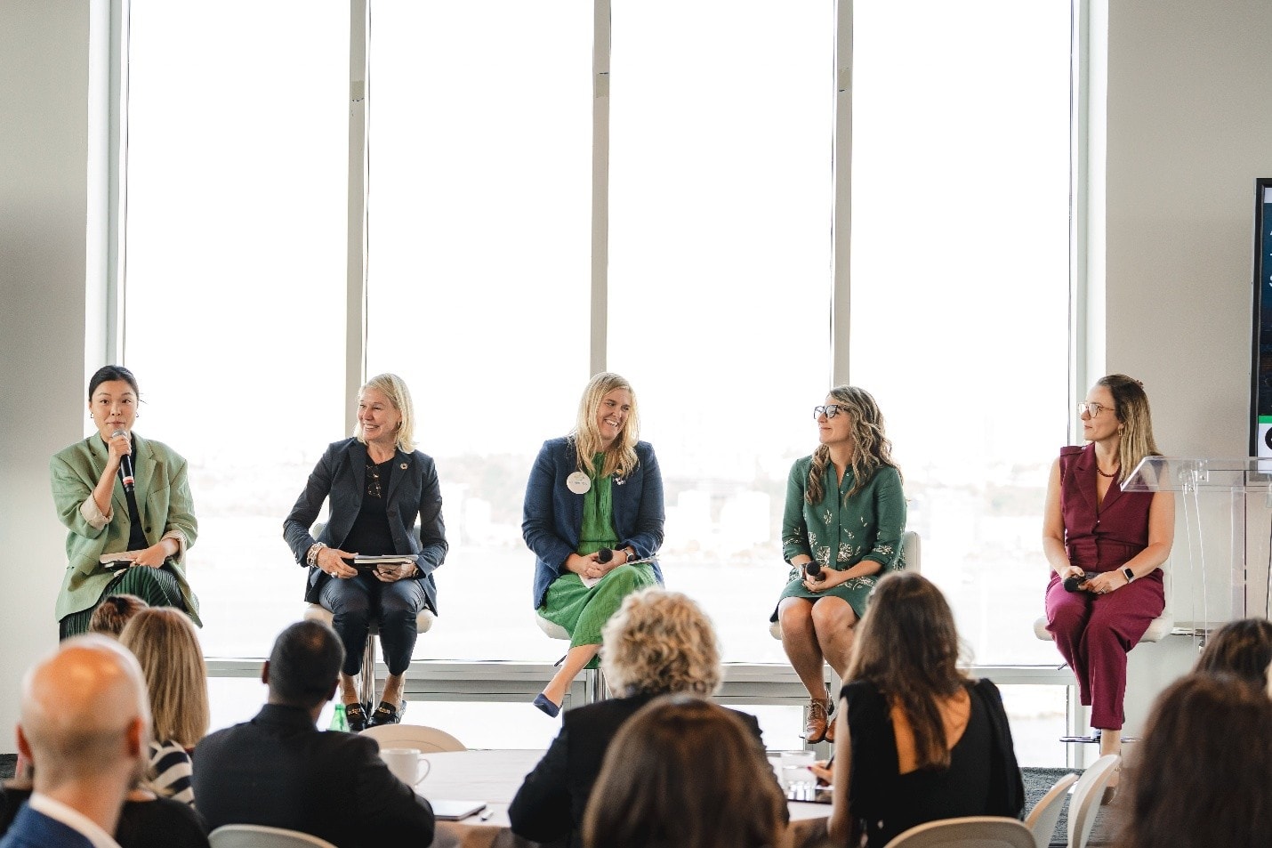 A group of women sitting in a roomAI-generated content may be incorrect.