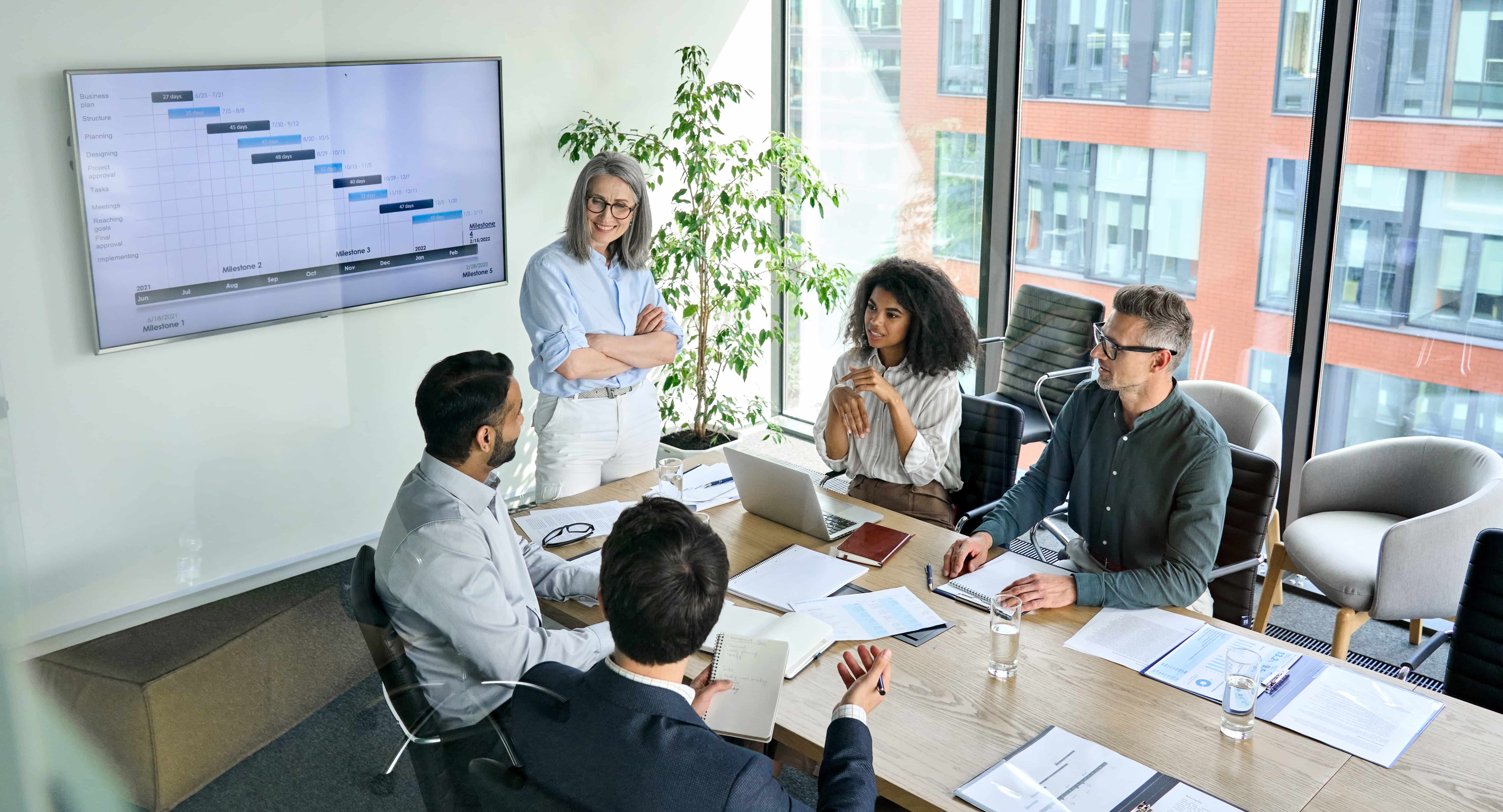 People in an office talking around a table