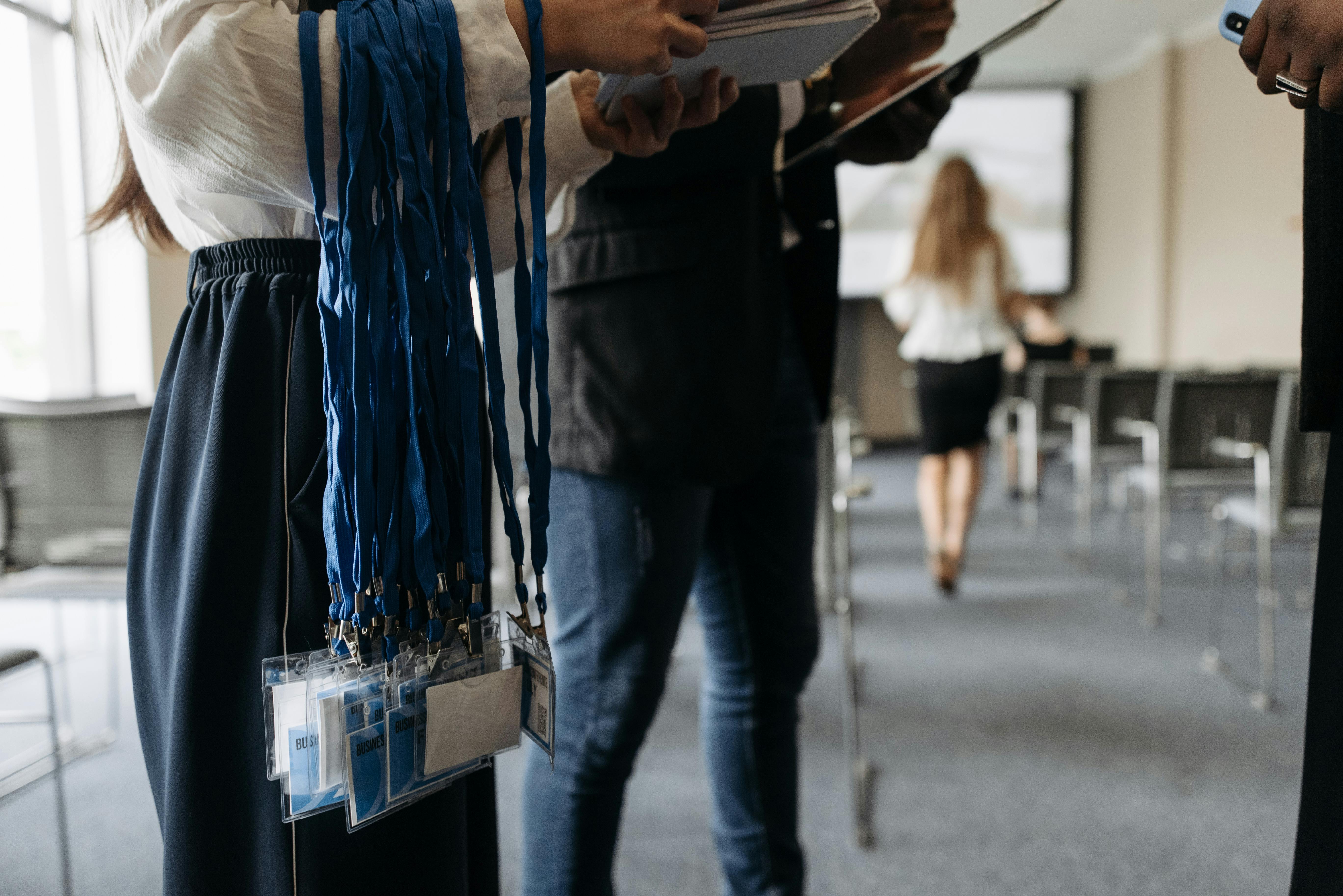 Photo by Pavel Danilyuk on Pexels https://www.pexels.com/photo/badges-on-lanyards-8761304/ 