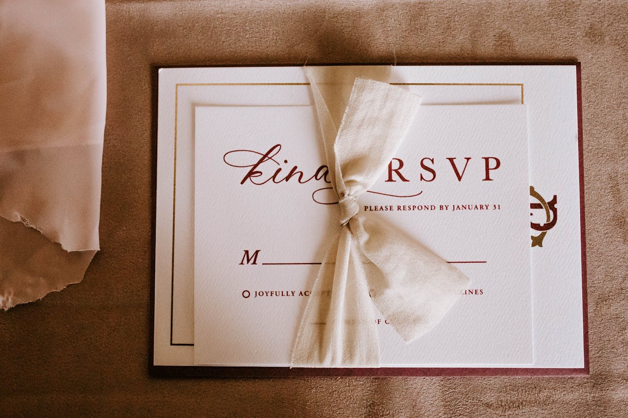 https://www.pexels.com/photo/invitation-card-with-the-inscription-tied-with-ribbon-6479559/ Photo by Tara Winstead on Pexels