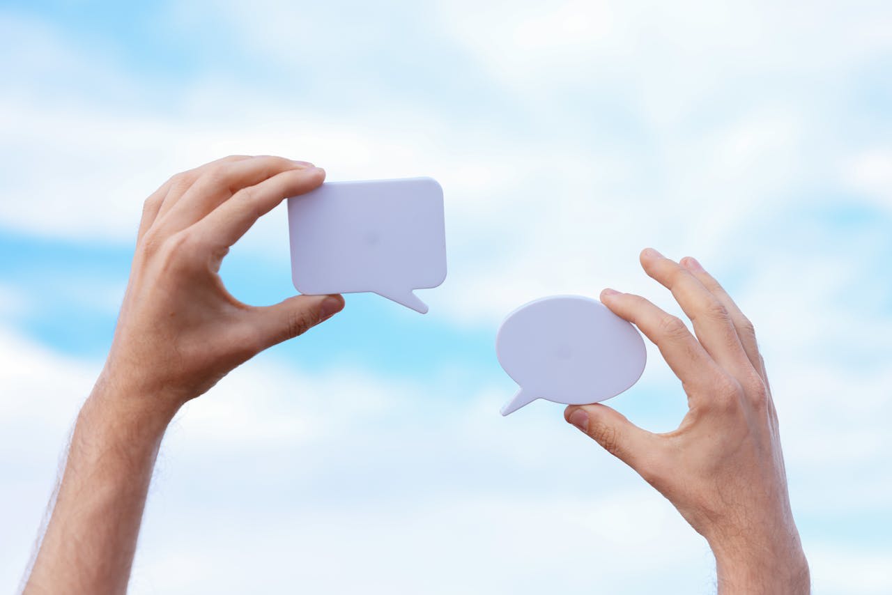 Photo by Cup of  Couple: https://www.pexels.com/photo/close-up-of-man-holding-paper-cutouts-in-the-shape-of-conversational-clouds-8015694/ 
