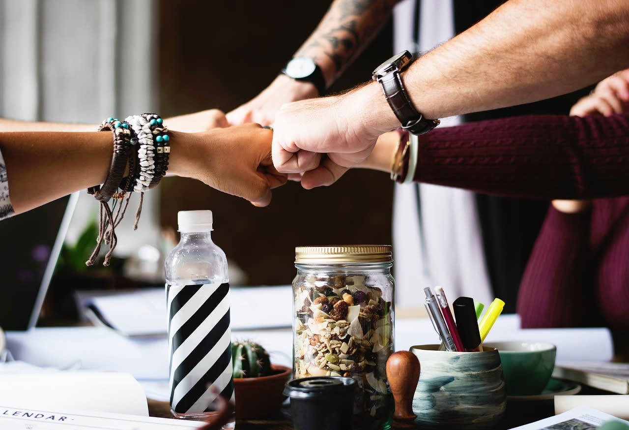 https://pixabay.com/photos/people-group-friends-fist-bump-2569234/ Image by StockSnap from Pixabay