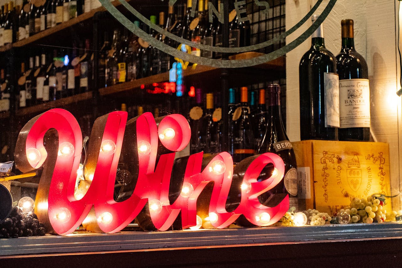 Photo by Brett Sayles on Pexels https://www.pexels.com/photo/red-wine-marquee-signage-on-table-1374552/ 