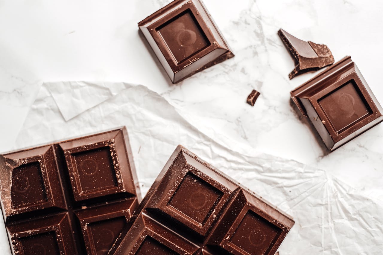 Photo by Vie Studio on Pexels https://www.pexels.com/photo/chocolate-bars-on-white-paper-6167329/ 