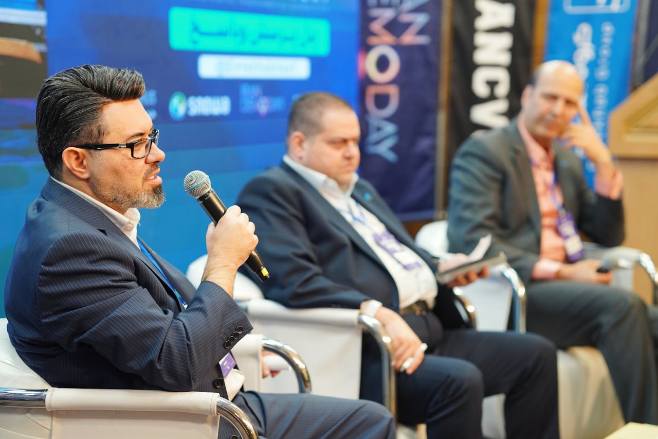 Photo by Reza Tavakoli: https://www.pexels.com/photo/business-panel-discussion-at-a-conference-29335353/ 