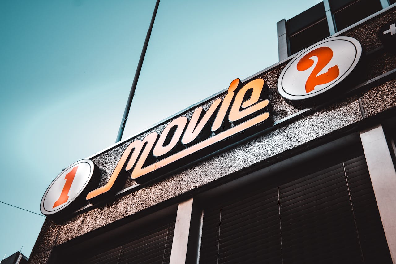https://www.pexels.com/photo/1-movie-2-signage-under-white-clouds-1200450/ Photo by Louis on Pexels