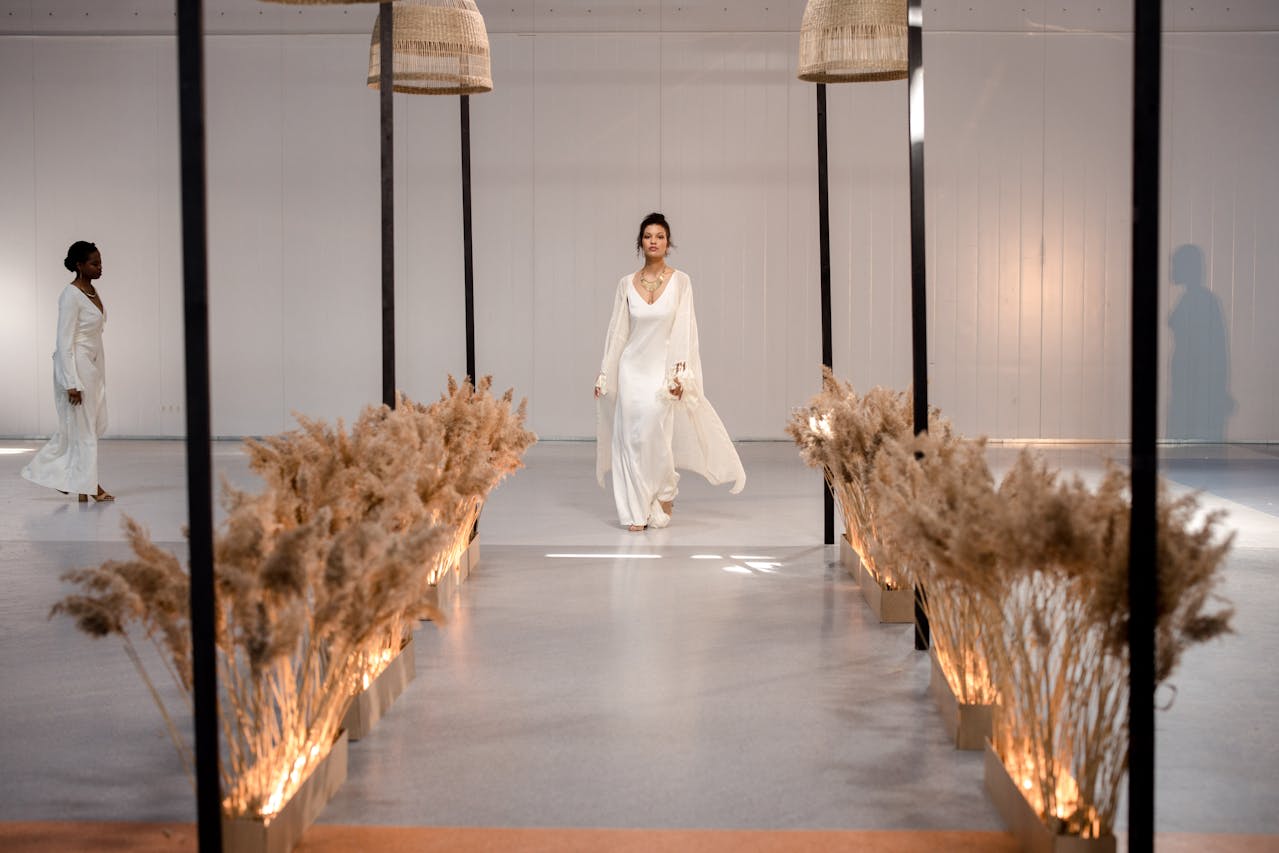 Photo by cottonbro studio: https://www.pexels.com/photo/a-model-wearing-a-white-dress-walking-on-the-runway-9511241/