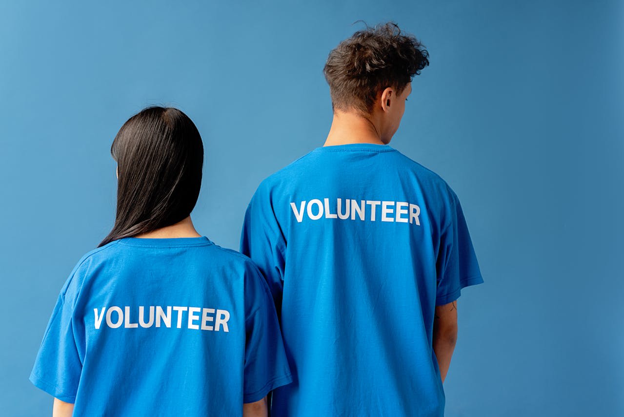 https://www.pexels.com/photo/man-and-woman-wearing-blue-shirts-with-printed-text-8543395/  Photo by Mikhail Nilov on Pexels 