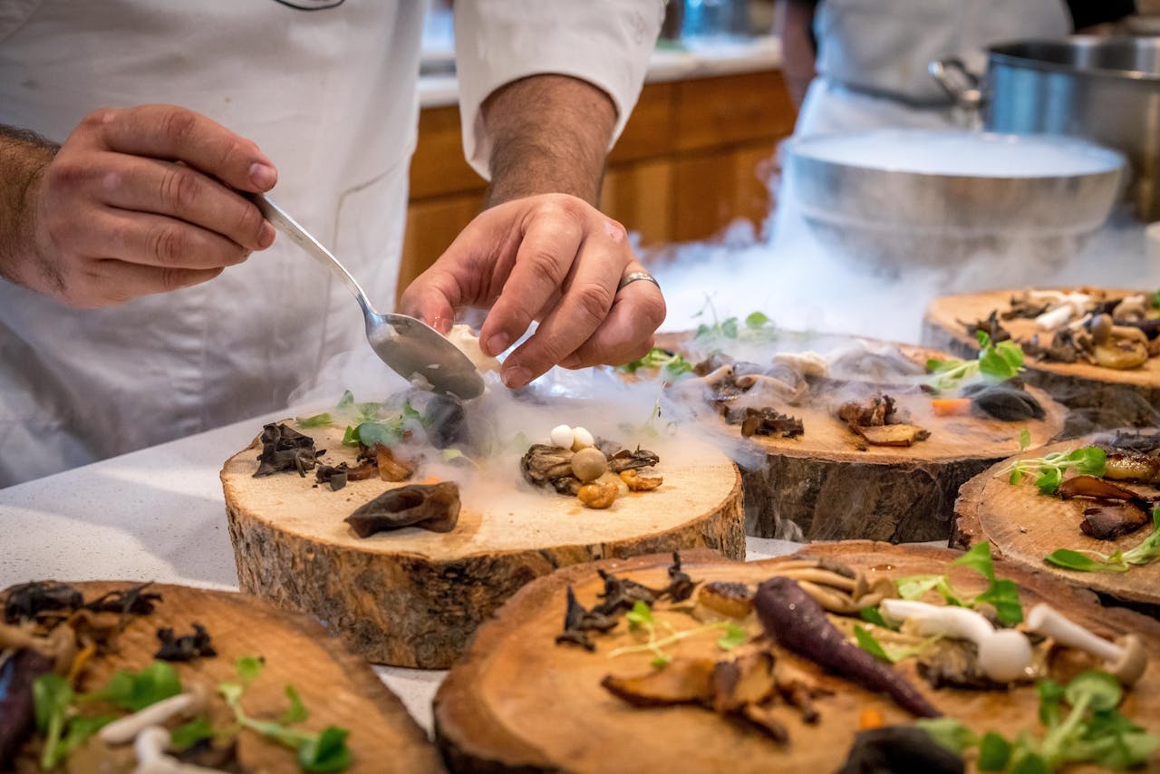 Photo by ELEVATE: https://www.pexels.com/photo/chef-preparing-vegetable-dish-on-tree-slab-1267320/ 