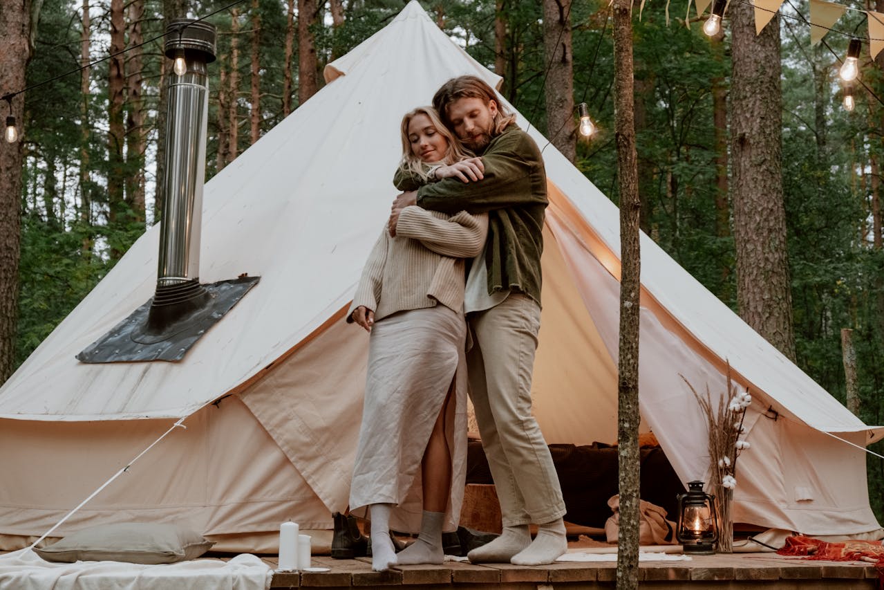 https://www.pexels.com/photo/photo-of-a-couple-hugging-near-a-white-tent-5358783/  Photo by cottonbro studio on Pexels 