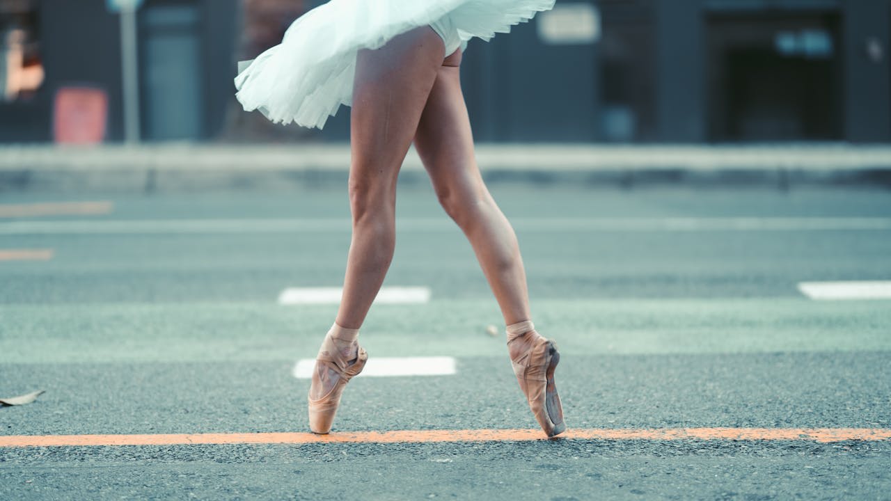 https://www.pexels.com/photo/a-ballerina-walking-on-the-street-wearing-spitzen-5051170/  Photo by Taryn Elliot on Pexels